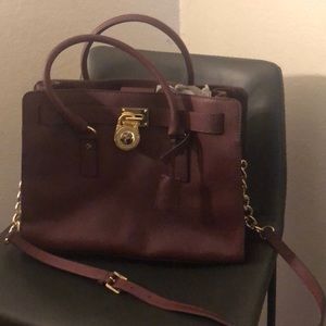 MK maroon handbag